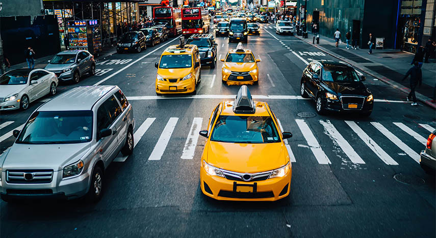 Cars and taxis on city street