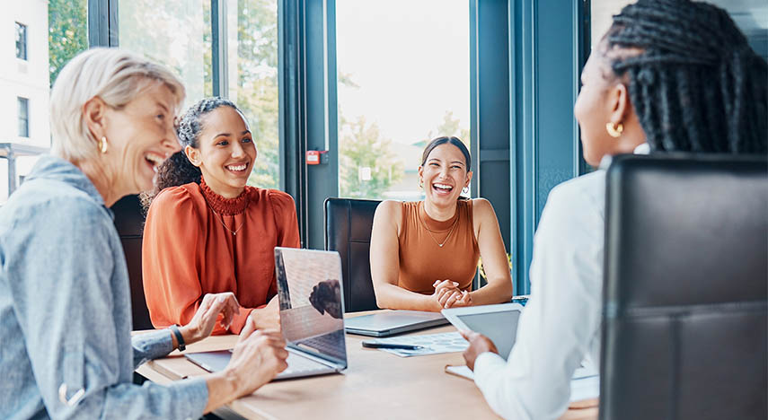People sitting at table in boardroom