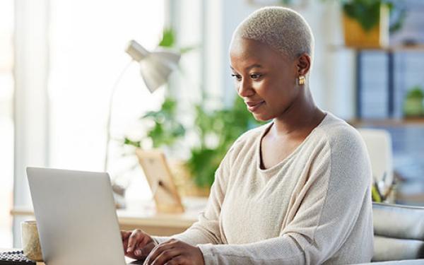 woman confidently using laptop