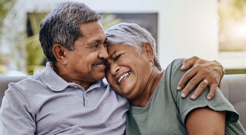 Elderly couple sitting next to each other
