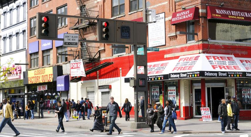 city street with people shopping at local businesses